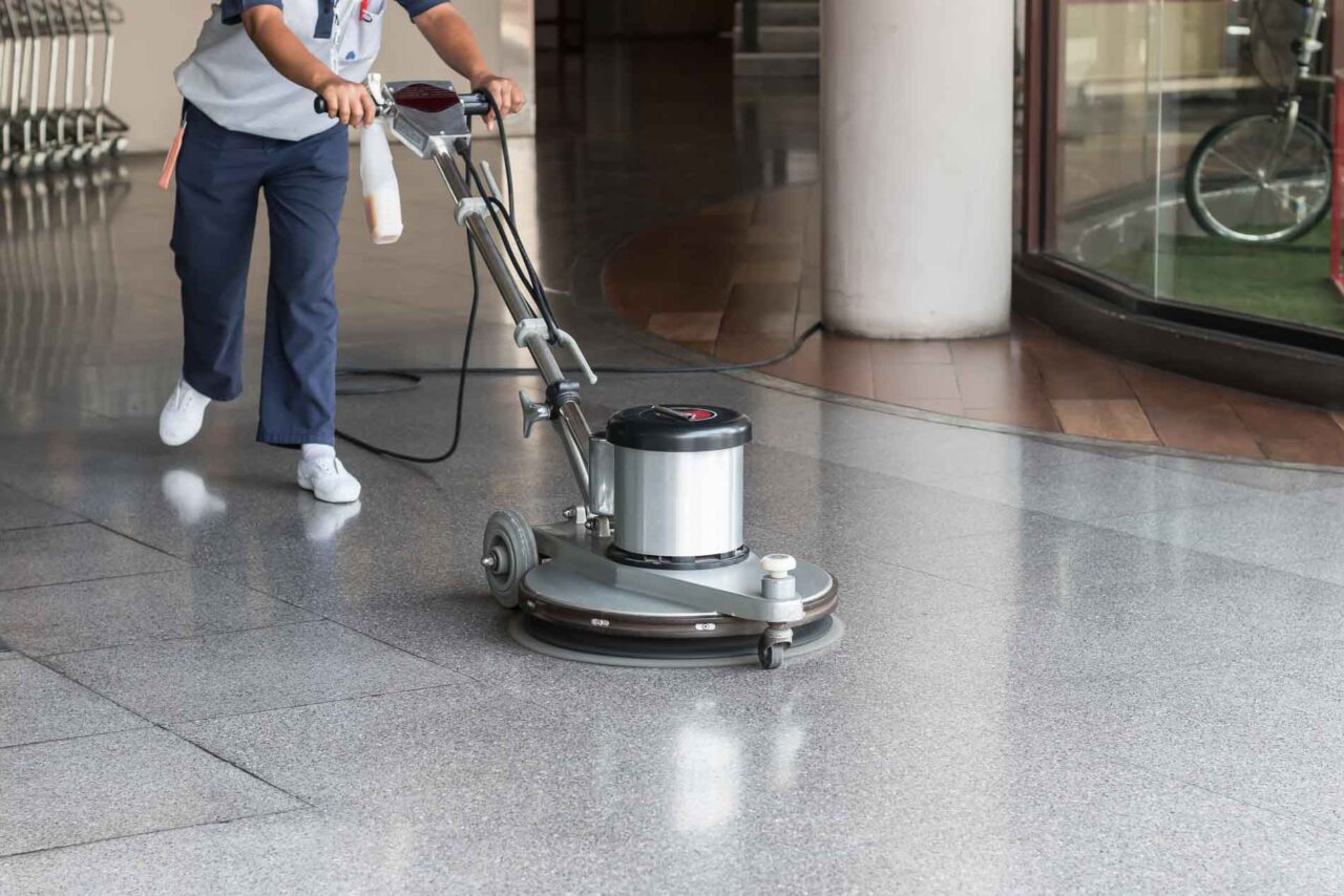 Woman,Worker,Cleaning,The,Floor,With,Polishing,Machine